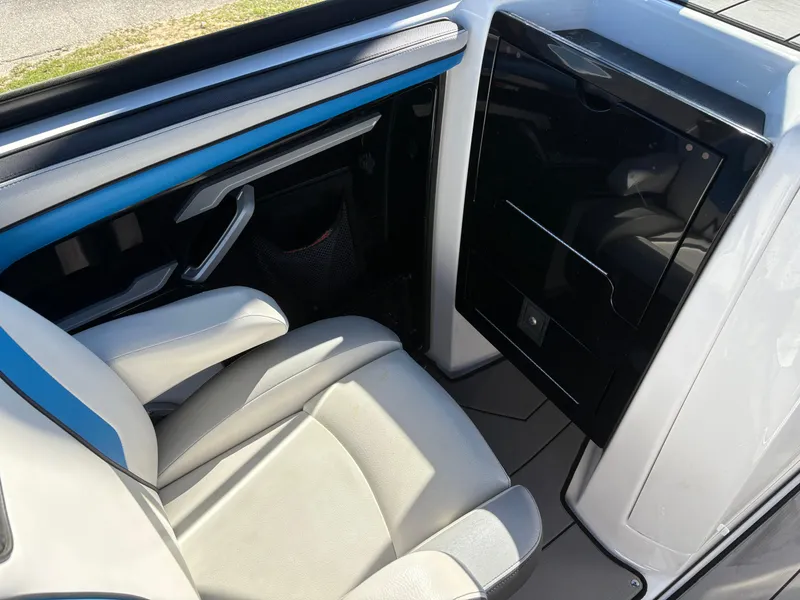 Slide: The Image of Interior of 2019 Yamaha Boats 242X E-Series, featuring sleek seating and modern design elements. - 10