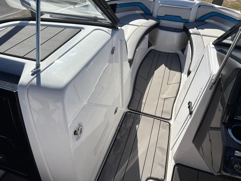 Slide: The Image of 2019 Yamaha Boats 242X E-Series interior with sleek seating and modern design. - 16