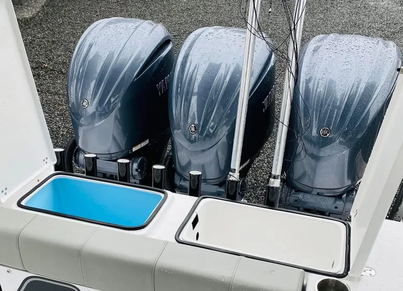 Slide: The Image of 2022 Cape Horn 36 XS boat with triple outboard engines and storage compartments. - 13