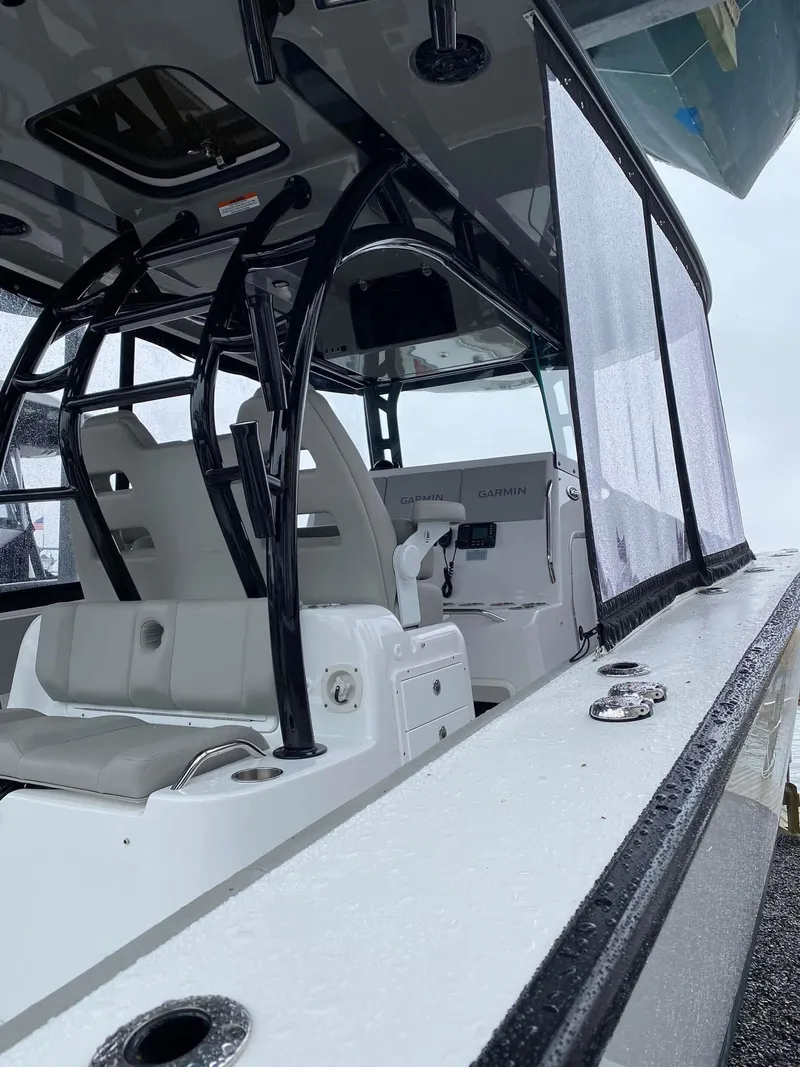 Slide: The Image of 2022 Cape Horn 36 XS boat interior with seating and console, showcasing sleek design and modern features. - 5