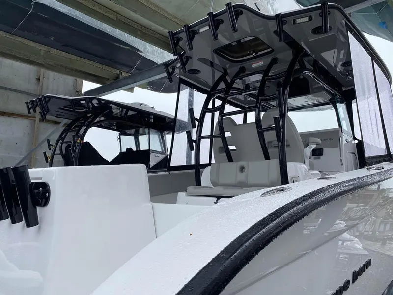 Slide: The Image of 2022 Cape Horn 36 XS boat under a shelter, showcasing sleek design and modern features. - 6