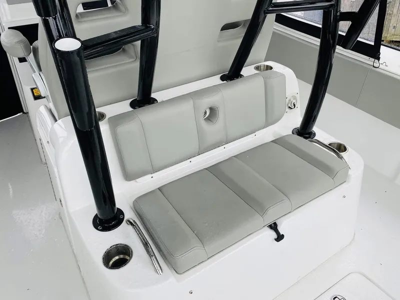 Slide: The Image of 2022 Cape Horn 36 XS boat seating area with cup holders and sturdy black frame. - 7