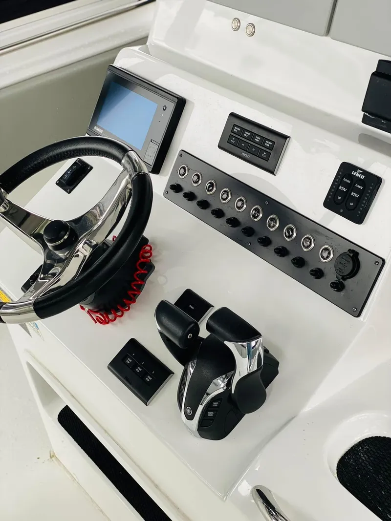 Slide: The Image of 2022 Cape Horn 36 XS boat dashboard with steering wheel and control panel. - 8