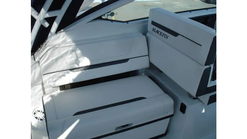 Slide: The Image of 2022 Blackfin 272 DC boat interior with white seating and sleek design. - 12