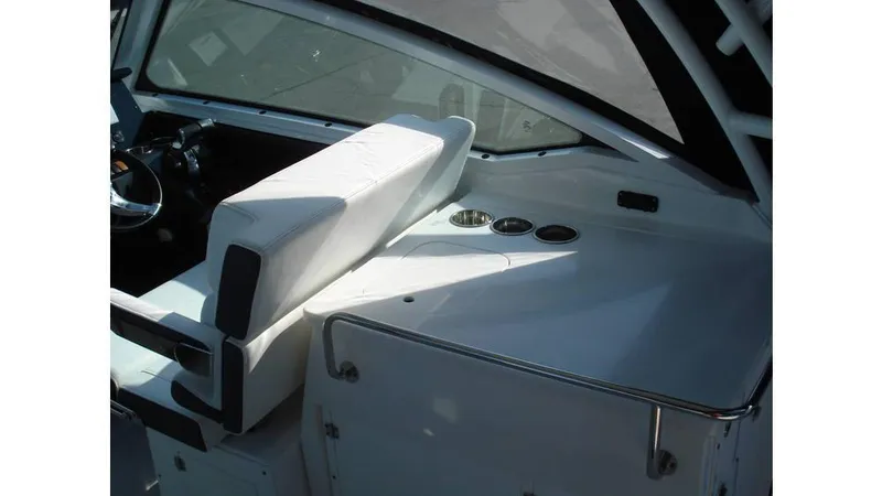 Slide: The Image of 2022 Blackfin 272 DC boat interior with white seating and control panel. - 13