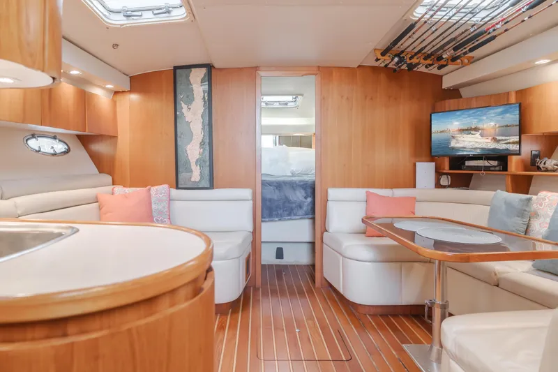 Slide: The Image of Luxurious 1996 Tiara Yachts 4300 interior with elegant wood finish and comfortable seating. - 2