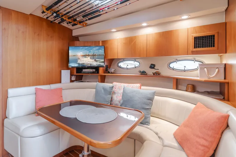 Slide: The Image of Luxurious 1996 Tiara Yachts 4300 interior with cozy seating and elegant decor. - 24