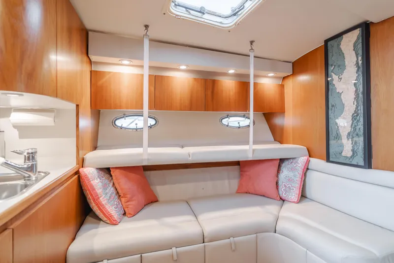 Slide: The Image of Luxurious interior of 1996 Tiara Yachts 4300 with cozy seating and elegant wood finish. - 25