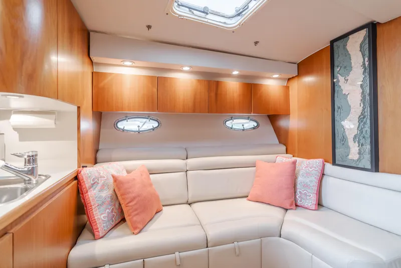 Slide: The Image of Luxurious interior of 1996 Tiara Yachts 4300 with plush seating and elegant decor. - 26
