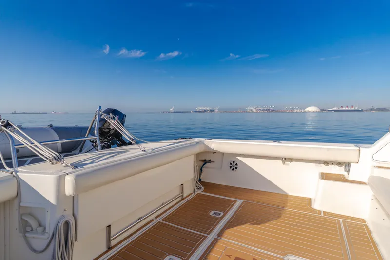 Slide: The Image of 1996 Tiara Yachts 4300 deck with ocean view under clear blue sky. - 34