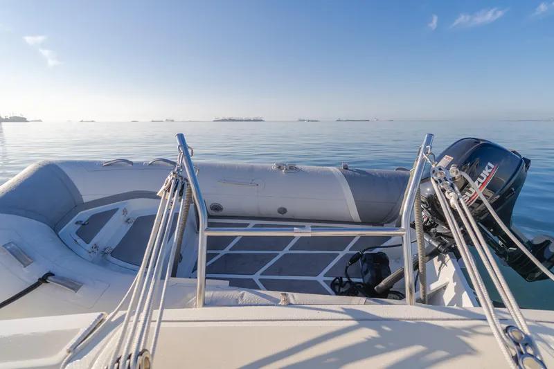 Slide: The Image of 1996 Tiara Yachts 4300 with outboard motor on calm water. - 36