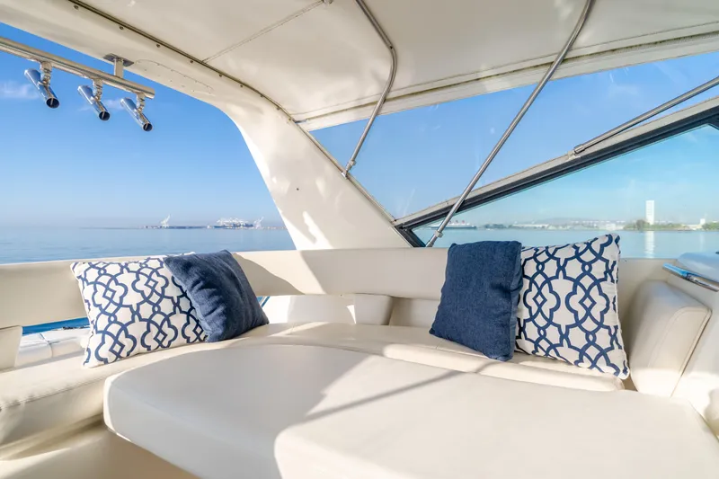 Slide: The Image of Luxurious 1996 Tiara Yachts 4300 interior with plush seating and decorative pillows. - 38