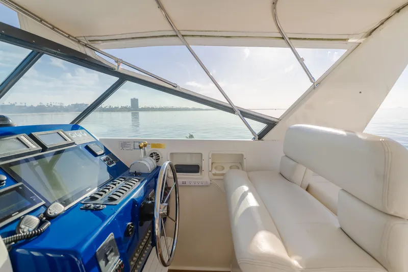 Slide: The Image of Interior view of 1996 Tiara Yachts 4300, featuring helm and seating area. - 40