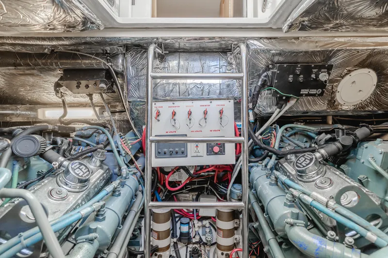Slide: The Image of Engine room of a 1996 Tiara Yachts 4300, showcasing dual engines and control panel. - 47