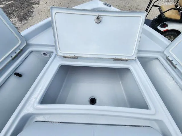 Slide: The Image of Open storage compartment on 2024 Blue Wave 2000 Classic boat. - 10