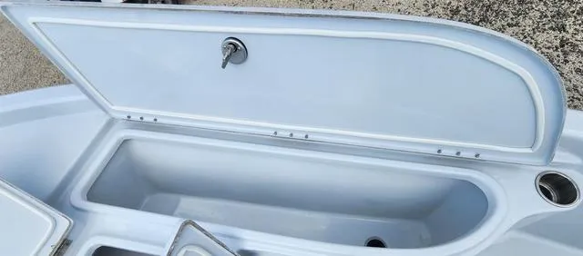 Slide: The Image of Open storage compartment of 2024 Blue Wave 2000 Classic boat. - 14