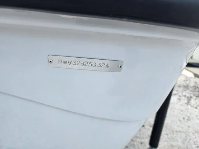 Slide: The Image of 2024 Blue Wave 2000 Classic boat with visible hull identification number. - 17