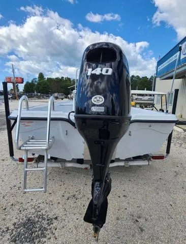 Slide: The Image of 2024 Blue Wave 2000 Classic boat with 140 HP outboard motor, rear view. - 5