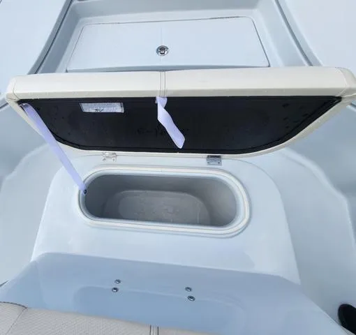 Slide: The Image of 2024 Blue Wave 2000 Classic boat storage compartment with open lid. - 6