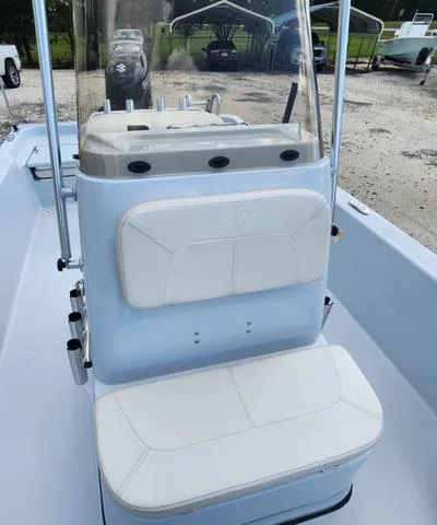 Slide: The Image of 2024 Blue Wave 2000 Classic boat interior with white seating and console. - 8