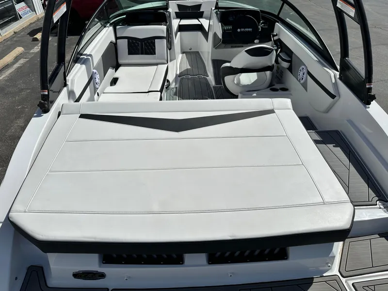 Slide: The Image of 2025 Monterey M22 boat interior with white seating and modern dashboard. - 4