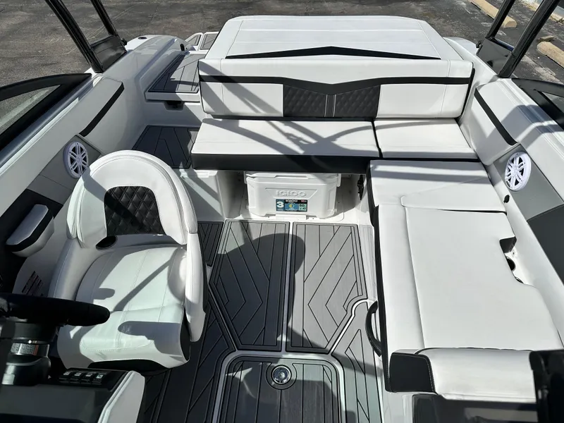 Slide: The Image of 2025 Monterey M22 boat interior with sleek seating and modern design. - 9