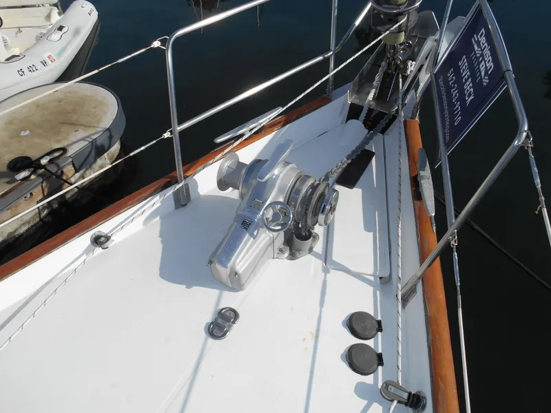 Slide: The Image of Deck of 2000 Beneteau Oceanis 50 sailboat with anchor winch and railing. - 19