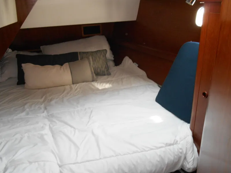 Slide: The Image of Cozy cabin interior of 2000 Beneteau Oceanis 50 sailboat with comfortable bedding. - 40