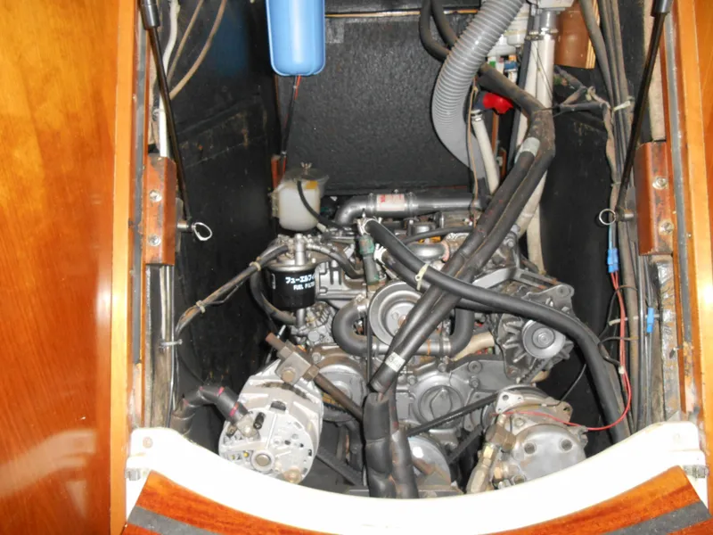 Slide: The Image of Engine compartment of a 2000 Beneteau Oceanis 50 sailboat, showcasing mechanical components. - 44