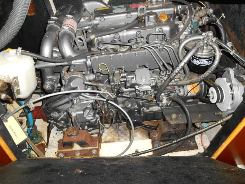Slide: The Image of Engine compartment of a 2000 Beneteau Oceanis 50 sailboat, showcasing detailed mechanical components. - 45