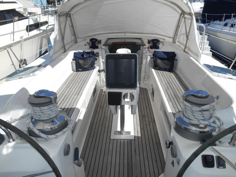 Slide: The Image of Beneteau Oceanis 50 sailboat cockpit, 2000 model, featuring teak decking and modern navigation equipment. - 5