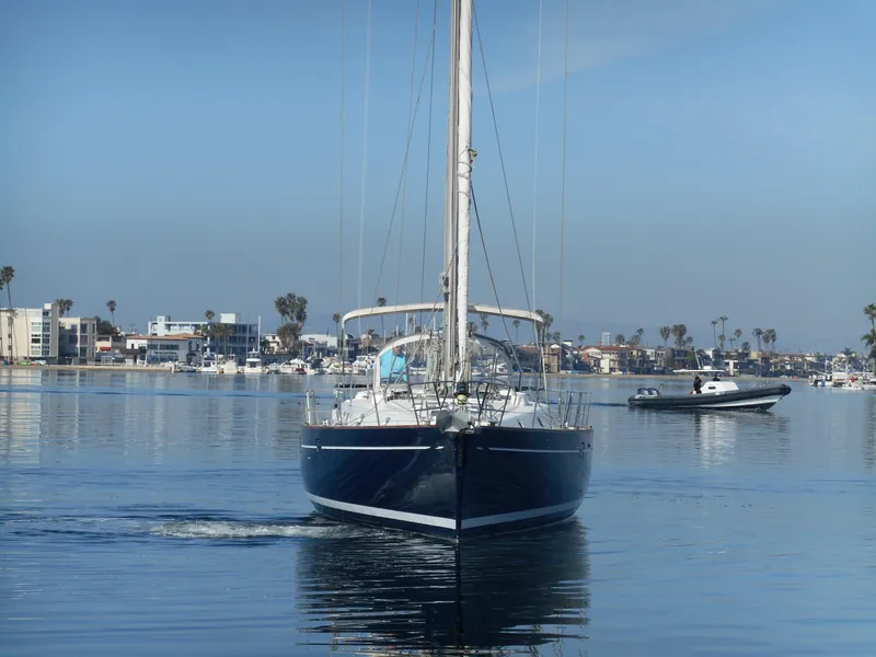 Slide: The Image of Beneteau Oceanis 50 sailboat from 2000 cruising in a calm marina. - 8