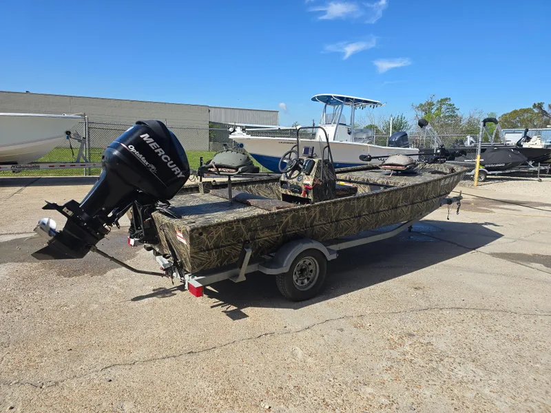 Slide: The Image of 2012 Lowe Roughneck 1860CC boat with Mercury outboard motor on trailer. - 4
