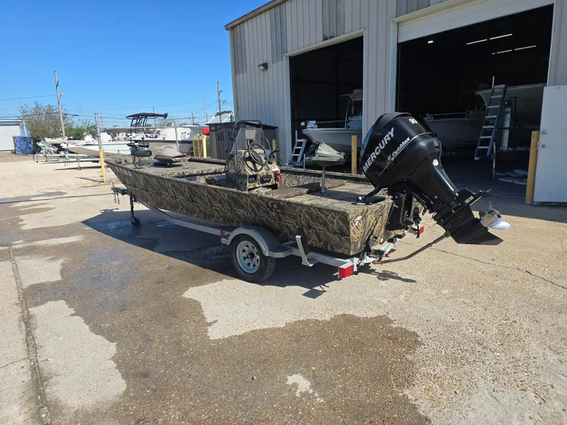 Slide: The Image of 2012 Lowe Roughneck 1860CC boat with Mercury outboard motor on trailer. - 5