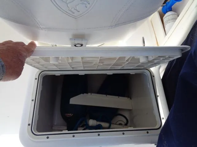 Slide: The Image of Storage compartment on a 2007 Century 2200 Walkaround boat, lid open, revealing interior. - 13
