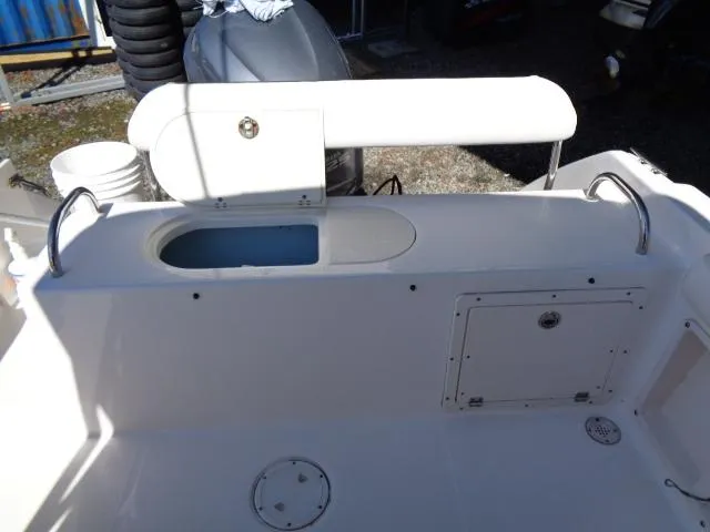 Slide: The Image of 2007 Century 2200 Walkaround boat interior with storage compartments and seating. - 18