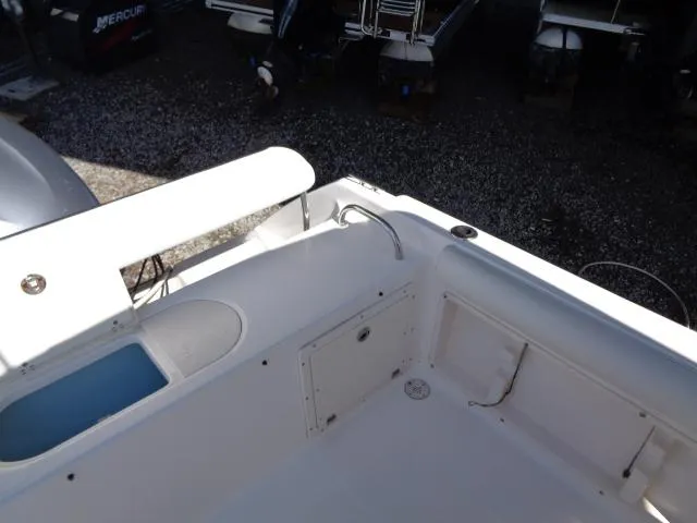 Slide: The Image of 2007 Century 2200 Walkaround boat interior with storage and seating area. - 19