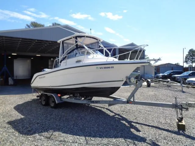 Slide: The Image of 2007 Century 2200 Walkaround boat on trailer outside a storage facility. - 2