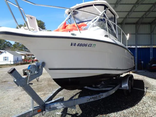 Slide: The Image of 2007 Century 2200 Walkaround boat on trailer in covered storage area. - 21