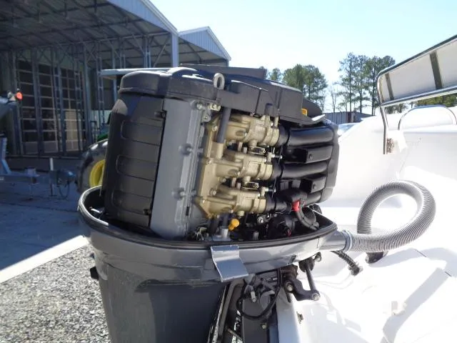 Slide: The Image of Outboard motor of a 2007 Century 2200 Walkaround boat in maintenance setup. - 22