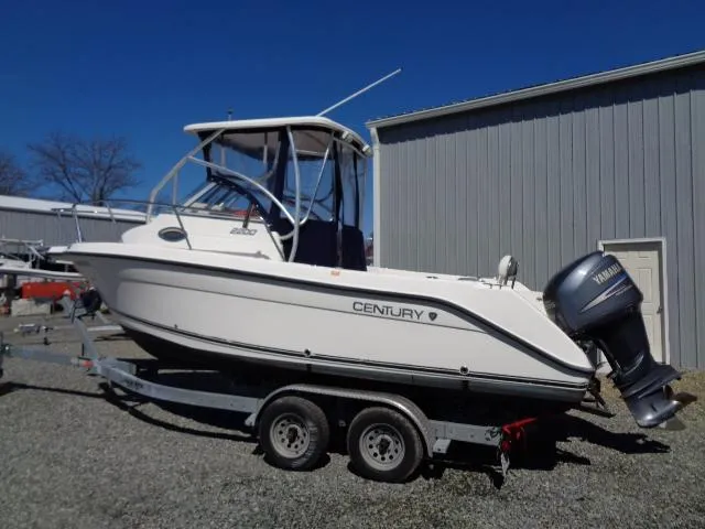 Slide: The Image of 2007 Century 2200 Walkaround boat on trailer, parked outdoors. - 3