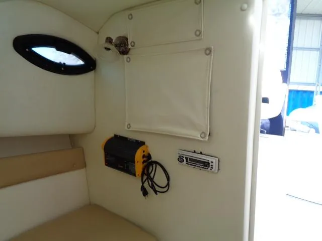 Slide: The Image of Interior of 2007 Century 2200 Walkaround boat with electronics and storage. - 6
