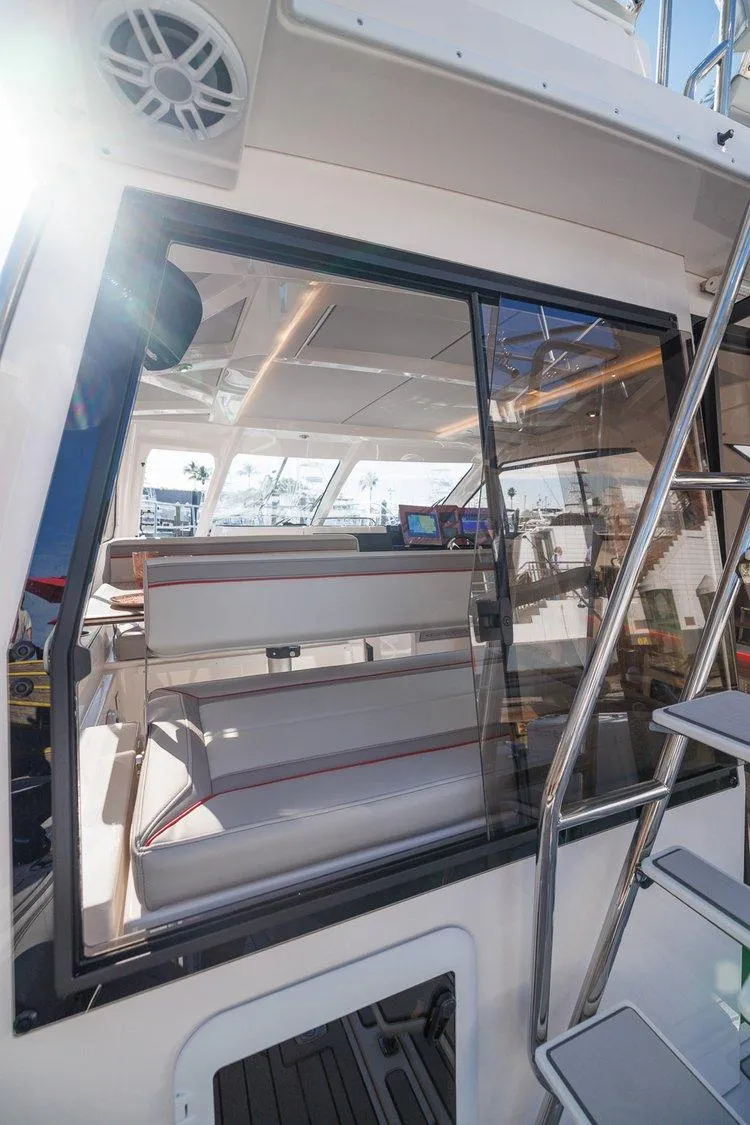 Slide: The Image of 2025 Solara S-310 SB boat interior with modern seating and sleek design. - 5