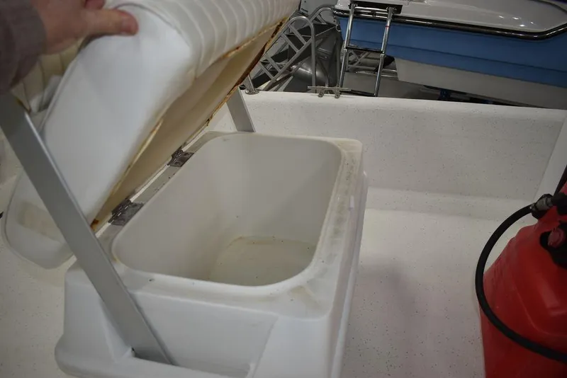 Slide: The Image of Open storage compartment on a 2011 Carolina Skiff J16 boat. - 13