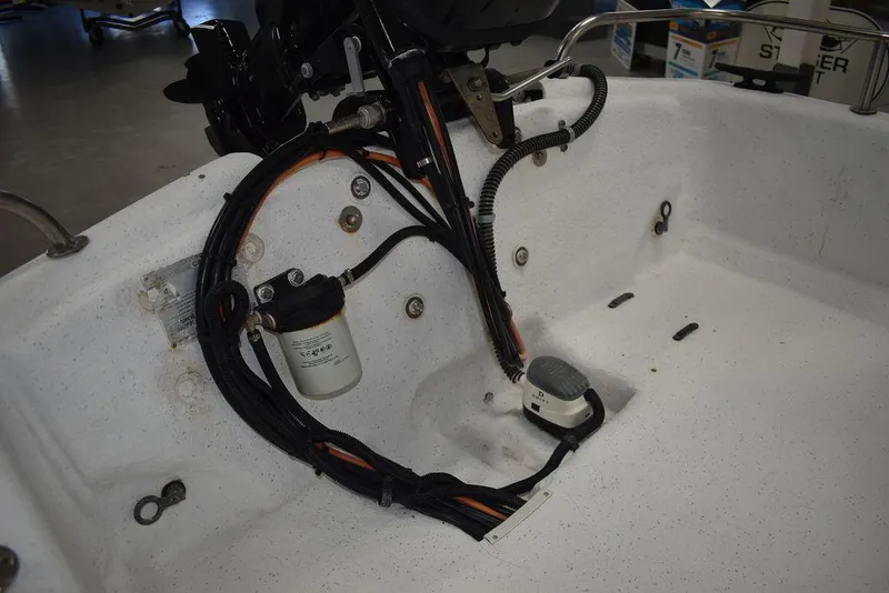 Slide: The Image of 2011 Carolina Skiff J16 boat interior showing wiring and components. - 15