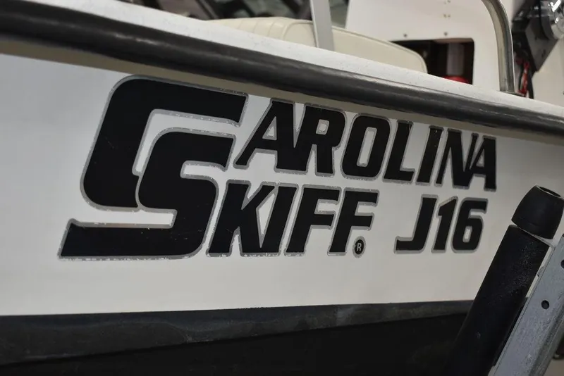 Slide: The Image of 2011 Carolina Skiff J16 boat logo on hull, close-up view. - 19