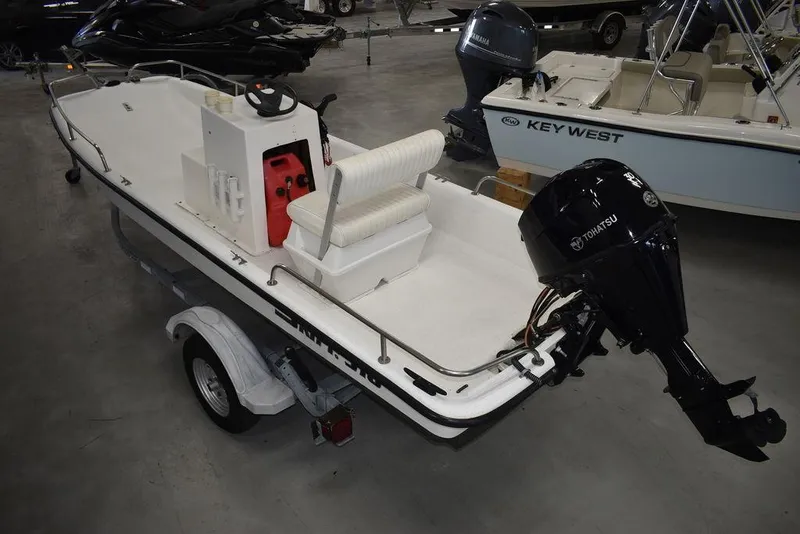 Slide: The Image of 2011 Carolina Skiff J16 boat with Yamaha outboard motor on trailer in showroom. - 5