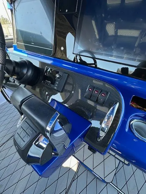 Slide: The Image of 2019 Mystic Powerboats M4200 dashboard with sleek controls and modern design. - 10