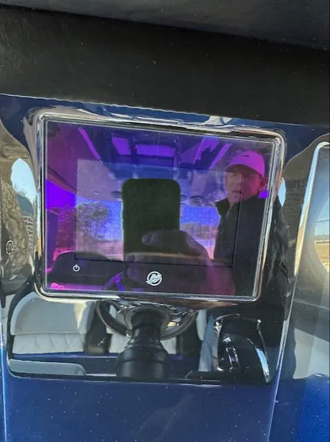 Slide: The Image of 2019 Mystic Powerboats M4200 dashboard with reflective screen and steering wheel. - 12