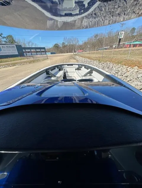 Slide: The Image of 2019 Mystic Powerboats M4200, sleek design, docked on a sunny day. - 13